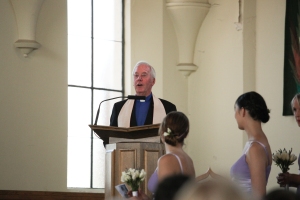 Dad speaking as the co-minster at my wedding, two years earlier